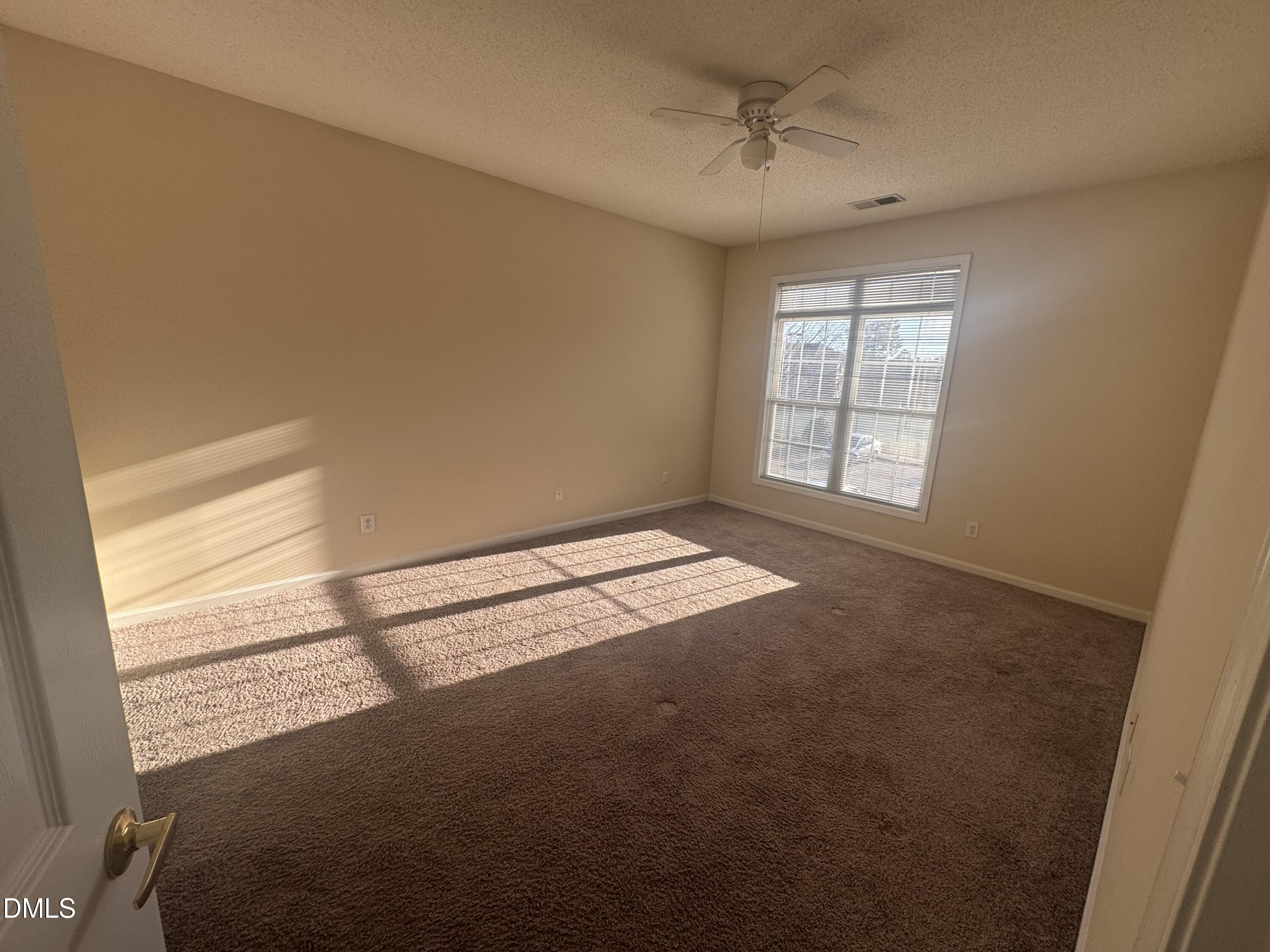 2510 Friedland Place, Unit 202 Raleigh, NC 27617 - Photo 20 of 25 a view of an empty room with a window