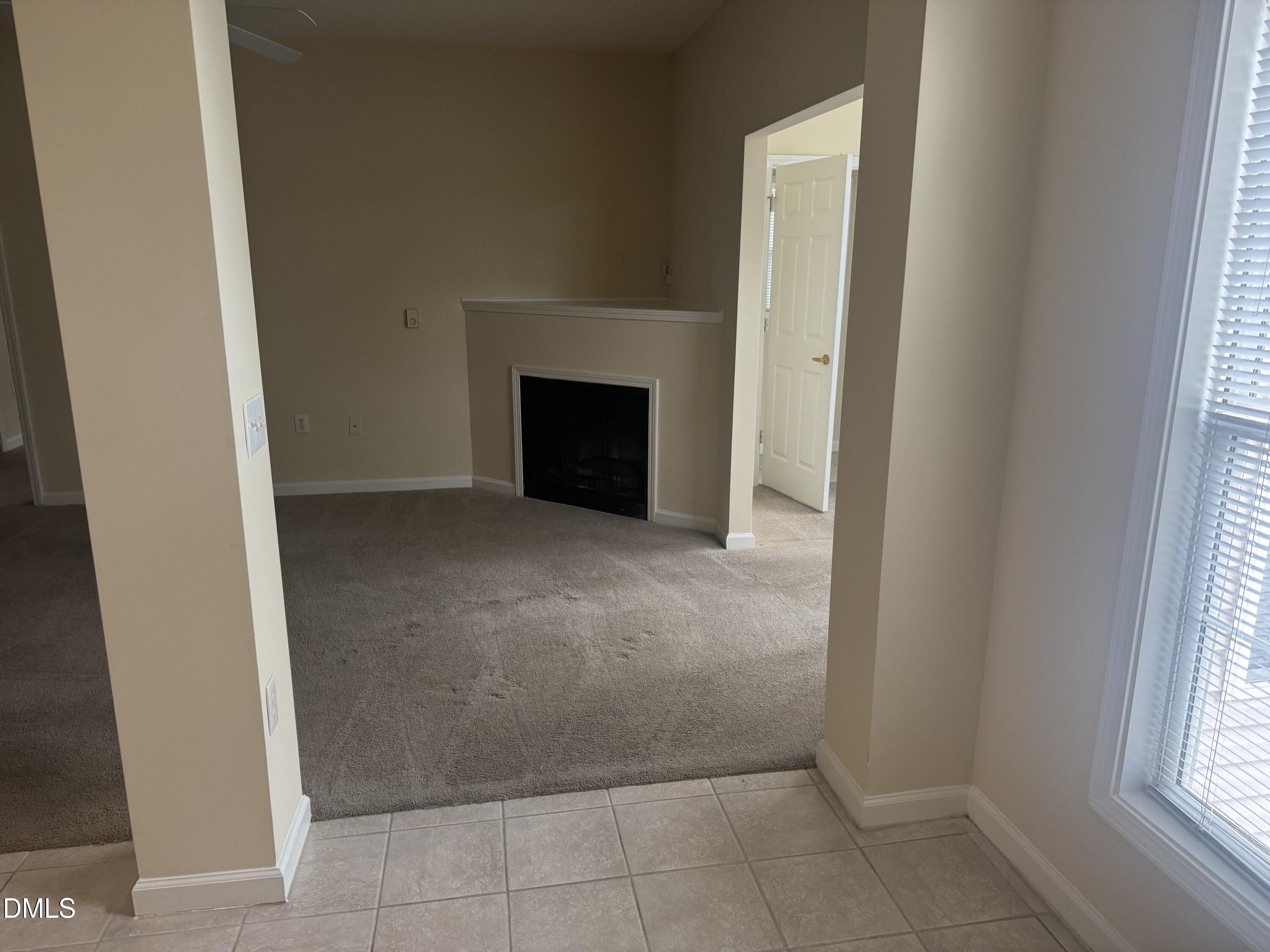 2510 Friedland Place, Unit 202 Raleigh, NC 27617 - Photo 5 of 25 a view of an empty room with a window