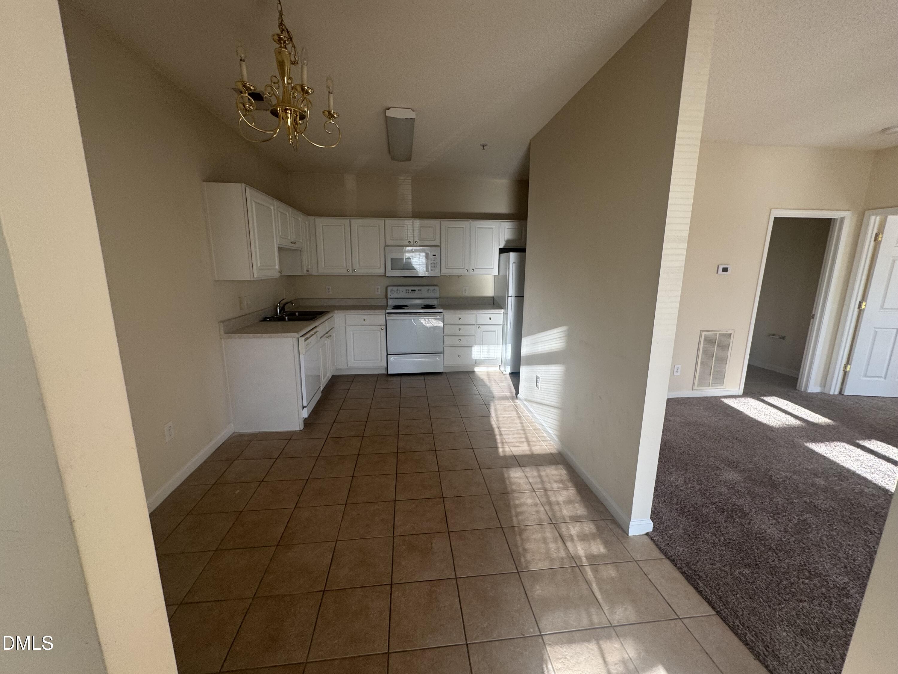2510 Friedland Place, Unit 202 Raleigh, NC 27617 - Photo 8 of 25 a view of entryway and kitchen