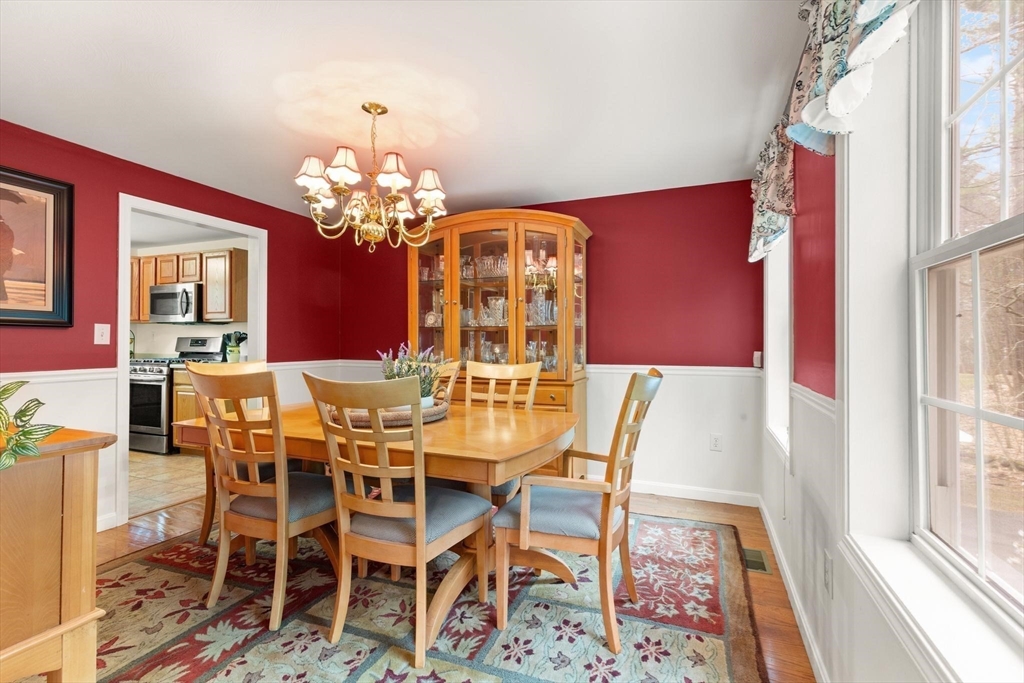41 Chestnut Road Tyngsborough, MA 01879 - Photo 8 of 32 a view of a dining room with furniture and a chandelier