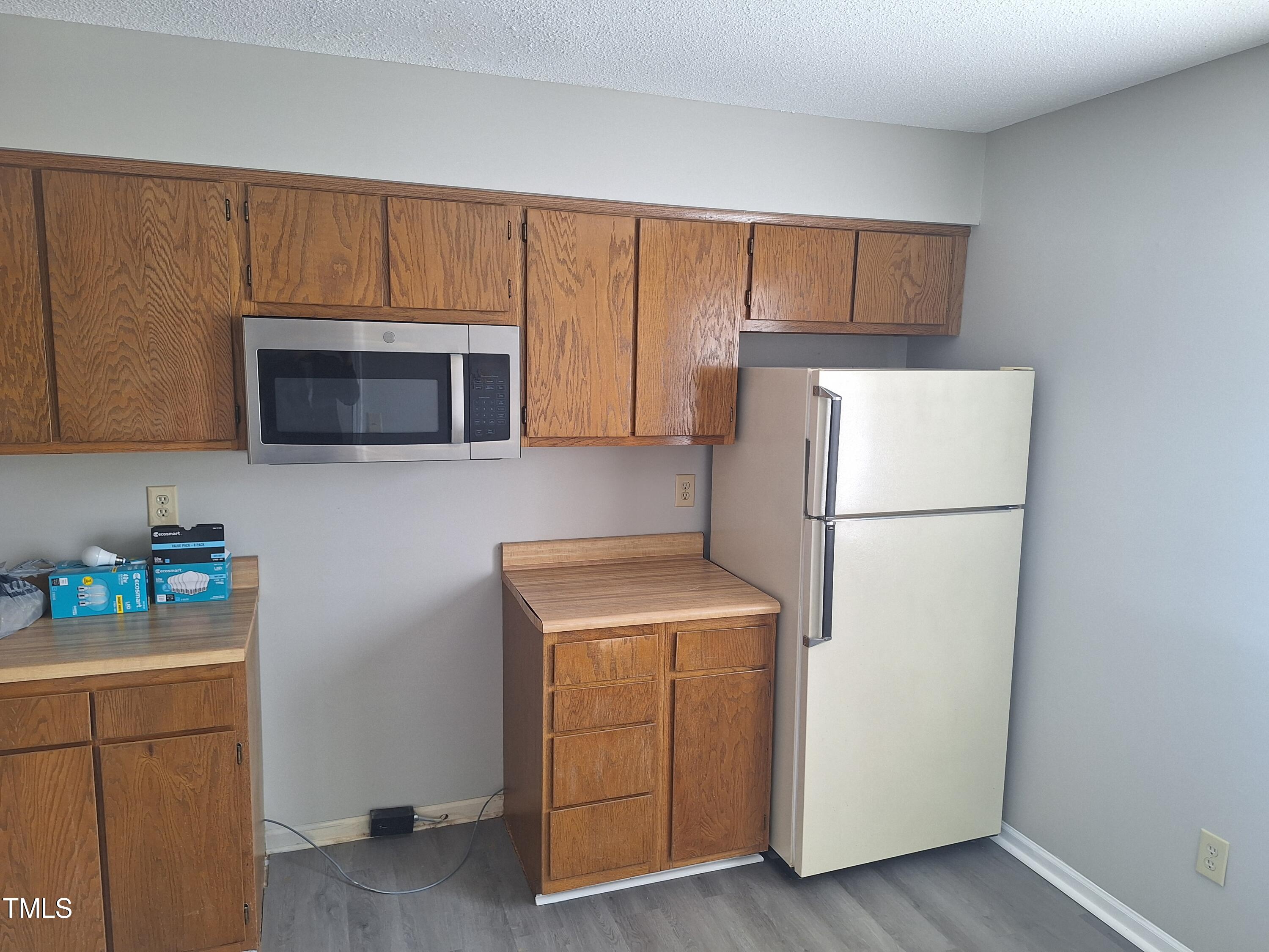 322 Junction Road, Unit 29B Durham, NC 27703 - Photo 3 of 12 a utility room with cabinets washer and dryer