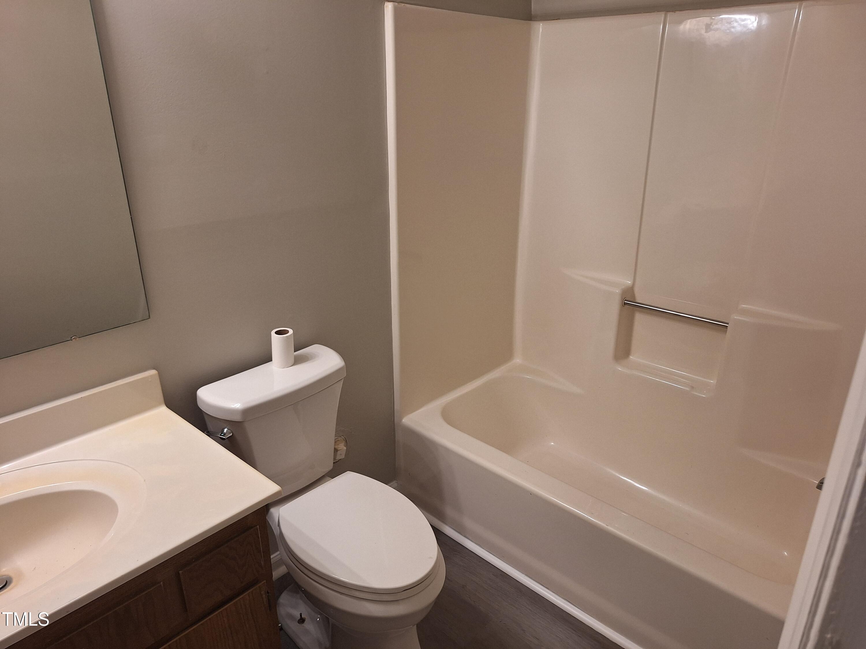 322 Junction Road, Unit 29B Durham, NC 27703 - Photo 5 of 12 a white toilet sitting next to a bath tub