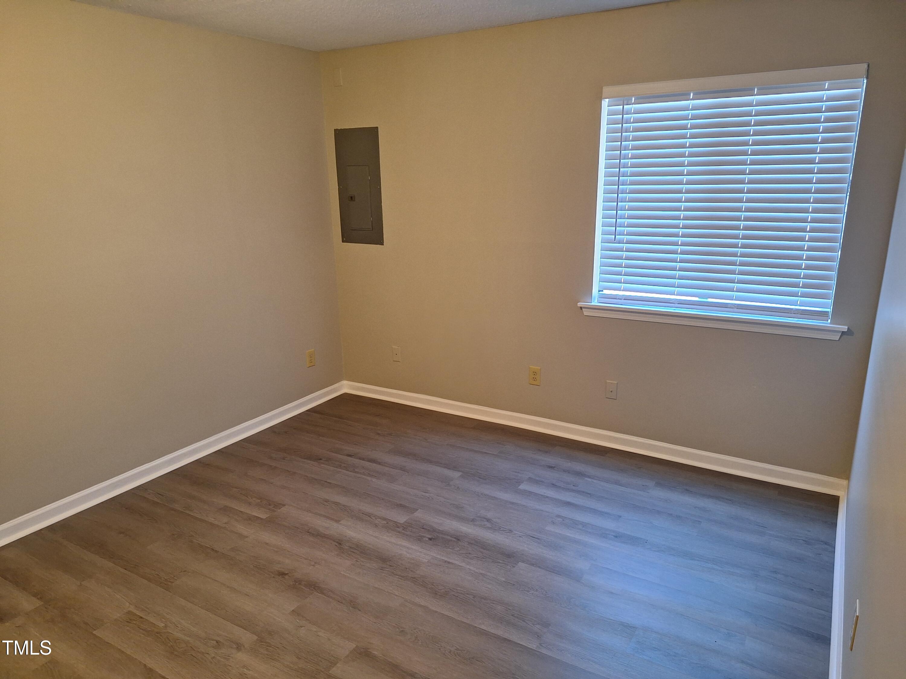 322 Junction Road, Unit 29B Durham, NC 27703 - Photo 9 of 12 wooden floor in an empty room with a window