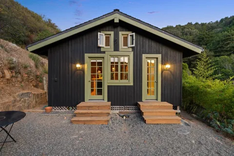 a front view of a house with garden