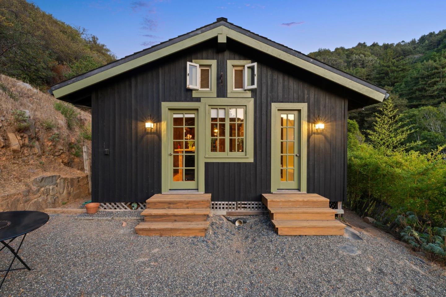 10026 Sycamore Canyon Road Big Sur, CA 93920 - Photo 12 of 67 a front view of a house with a yard
