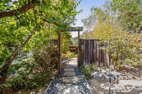 a view of a house with a backyard