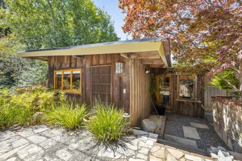 a outdoor living space with patio furniture and potted plants
