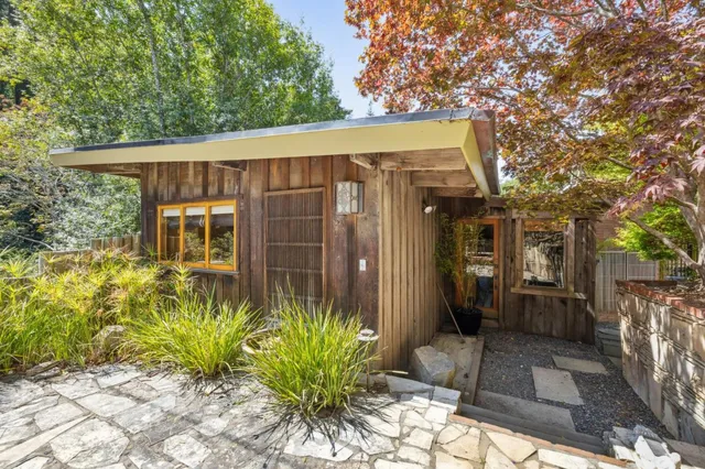 a outdoor living space with patio furniture and potted plants