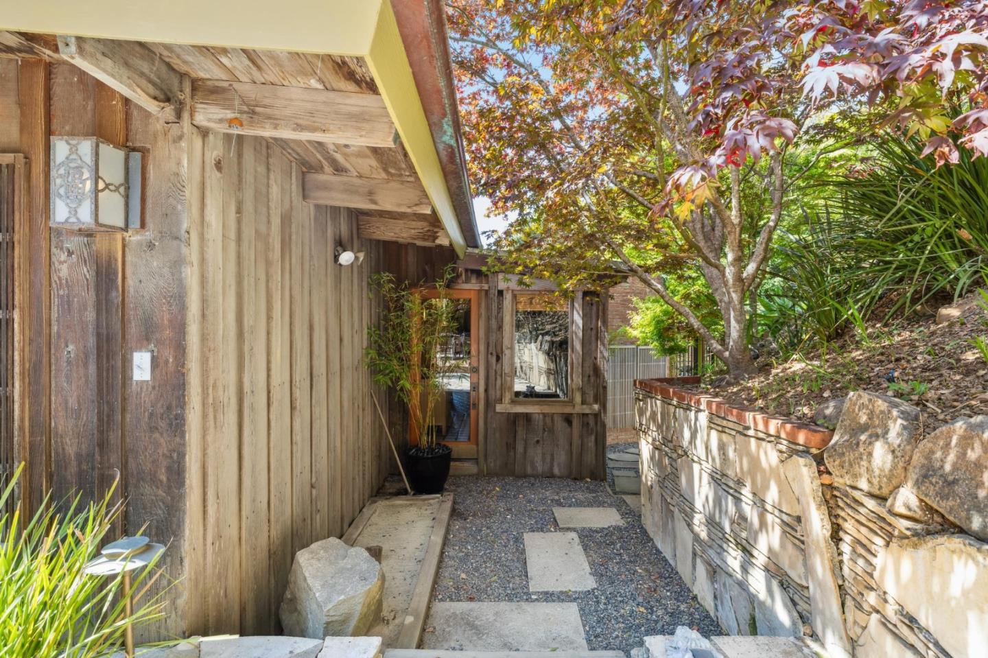 10026 Sycamore Canyon Road Big Sur, CA 93920 - Photo 17 of 67 a view of a house with a backyard