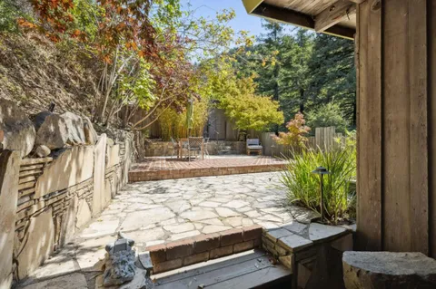 a dining room with furniture and a chandelier