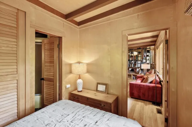 a view of a house with a door and wooden walls