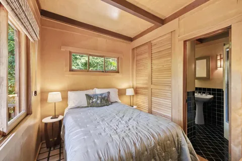 a living room with furniture oven and wooden floor