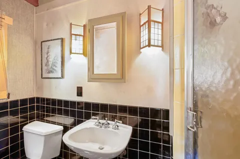 a living room with furniture a fireplace and a table