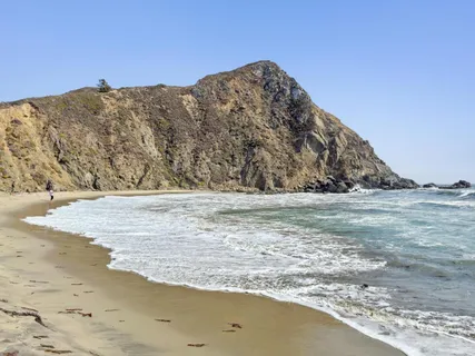 a view of a patio with table and chairs