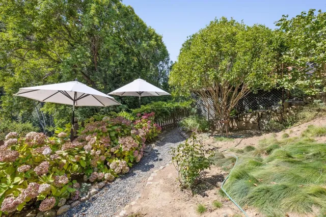 a stove top oven sitting inside of a kitchen