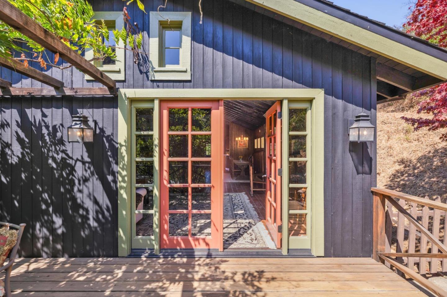 10026 Sycamore Canyon Road Big Sur, CA 93920 - Photo 43 of 67 a view of a house with a door and wooden walls