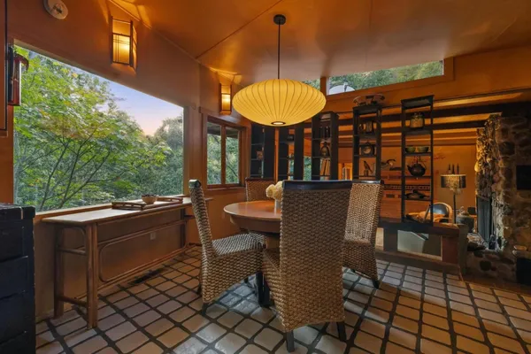 a view of balcony with wooden floor and iron fence