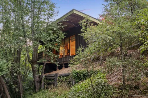 a kitchen with stainless steel appliances granite countertop a stove and a refrigerator