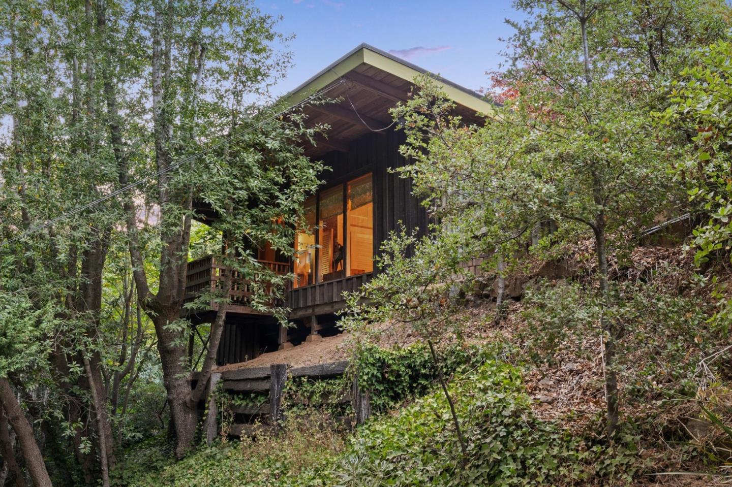 10026 Sycamore Canyon Road Big Sur, CA 93920 - Photo 8 of 67 front view of a house with a tree
