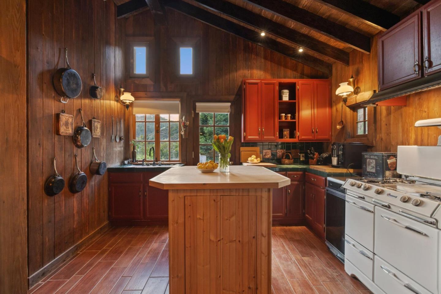 10026 Sycamore Canyon Road Big Sur, CA 93920 - Photo 10 of 67 a kitchen with stainless steel appliances granite countertop a stove and a refrigerator