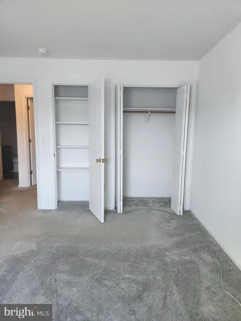 a view of an empty room and a garage