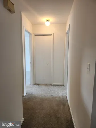 a view of hallway with closet