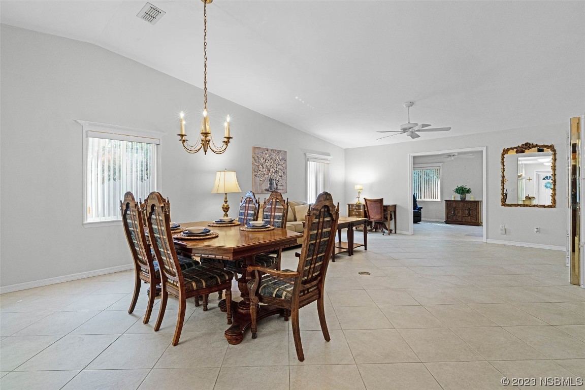 46 Big Buck Trail Ormond Beach, FL 32174 - Photo 15 of 41 a view of a dining room with furniture and chandelier