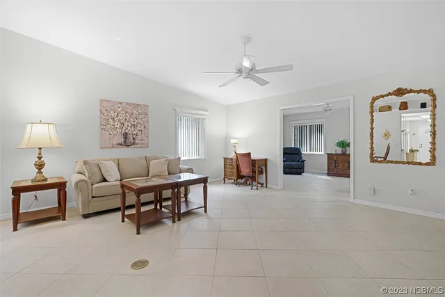 a living room with furniture and white walls