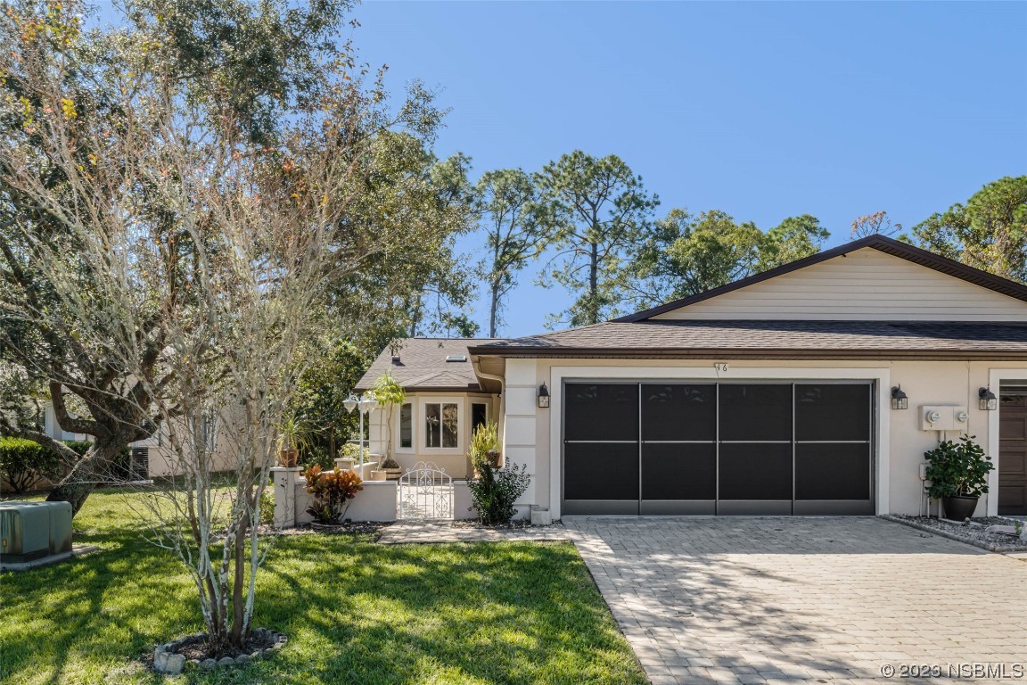 46 Big Buck Trail Ormond Beach, FL 32174 - Photo 2 of 41 a front view of a house with a yard and a porch