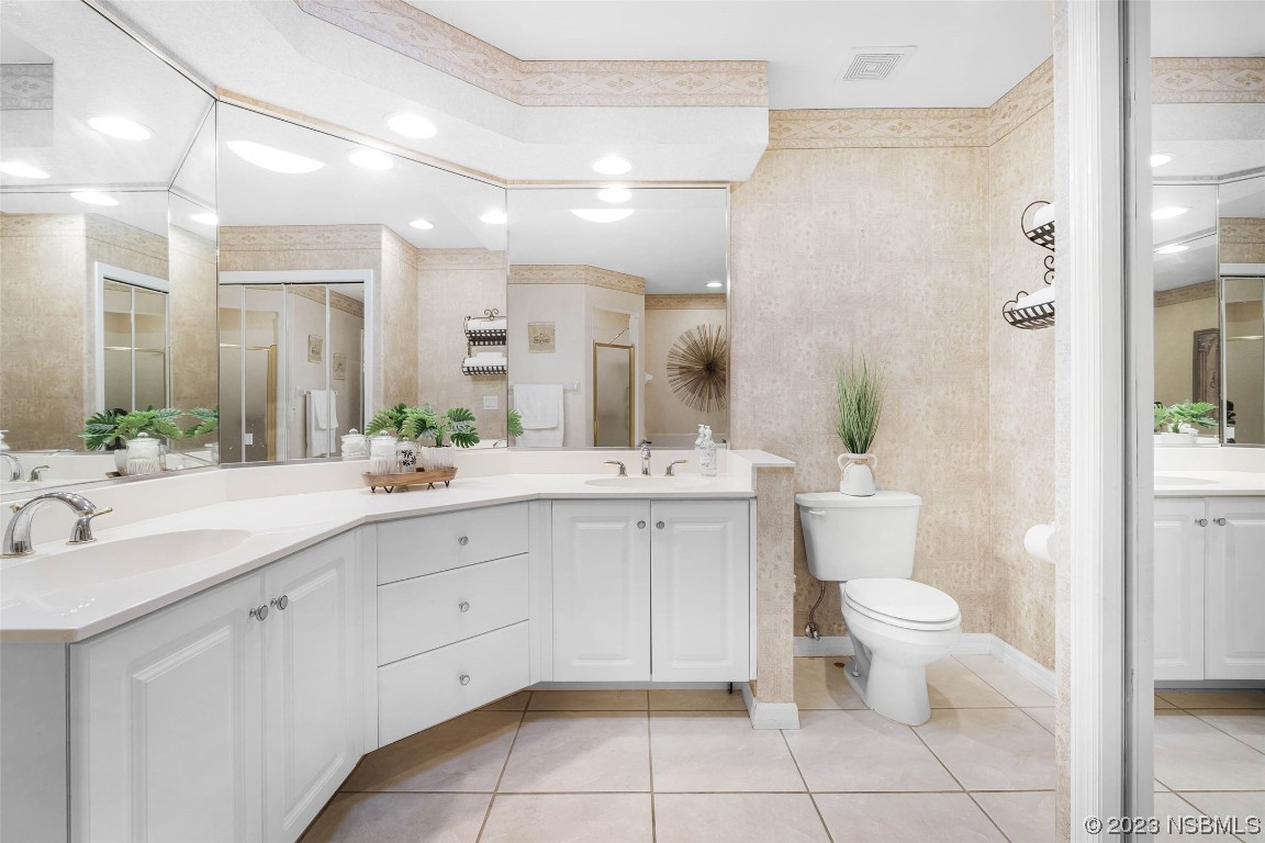 46 Big Buck Trail Ormond Beach, FL 32174 - Photo 25 of 41 a spacious bathroom with a double vanity sink a mirror and a toilet
