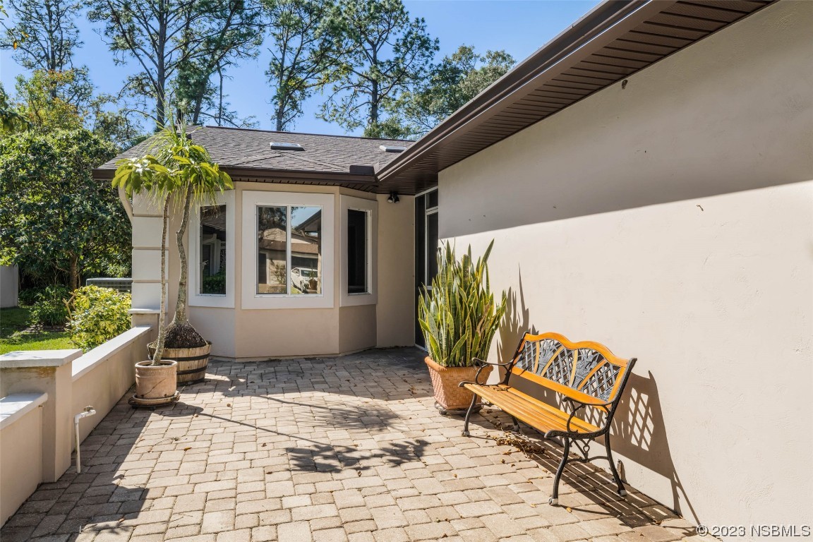 46 Big Buck Trail Ormond Beach, FL 32174 - Photo 3 of 41 a view of a chairs and table in the balcony