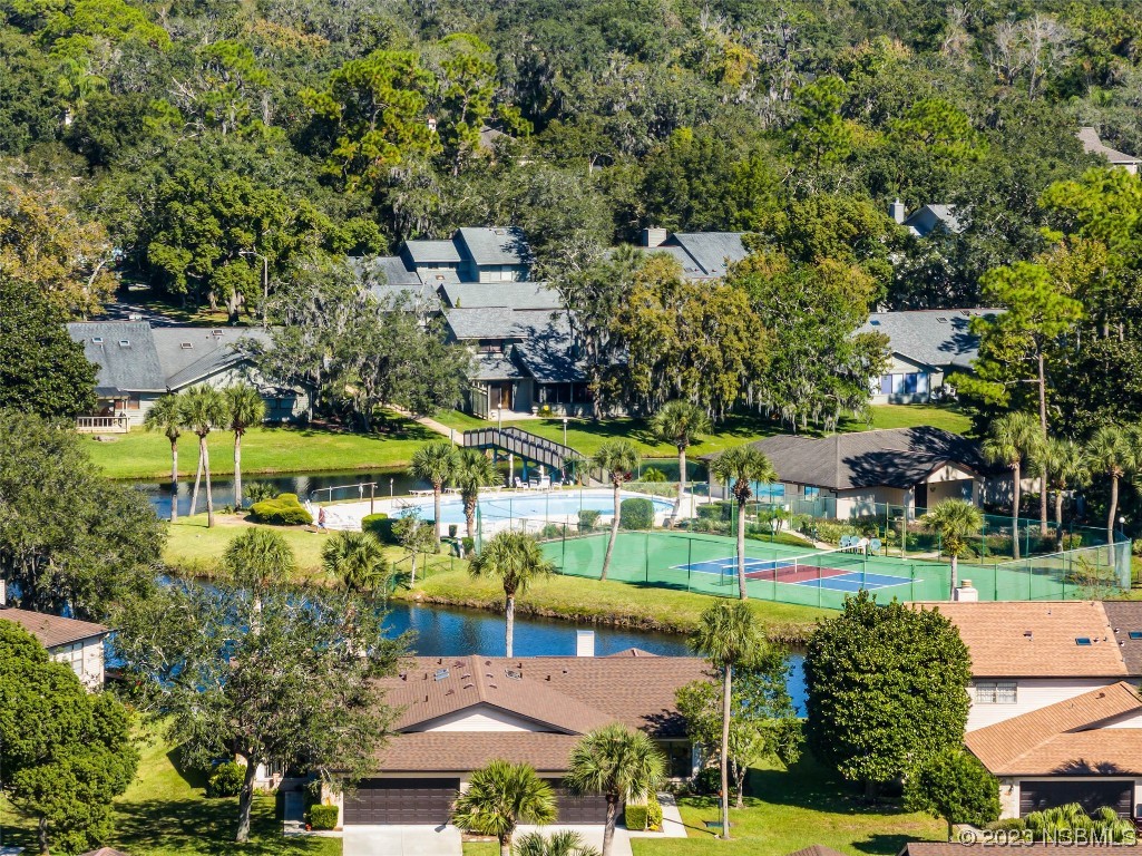 46 Big Buck Trail Ormond Beach, FL 32174 - Photo 35 of 41 an aerial view of a house with a garden and lake view