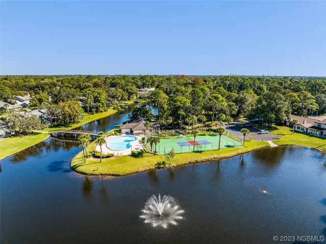 a view of a swimming pool with lounge chairs