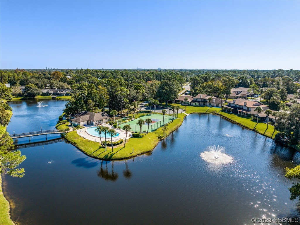 46 Big Buck Trail Ormond Beach, FL 32174 - Photo 39 of 41 a view of a swimming pool with a table and chairs