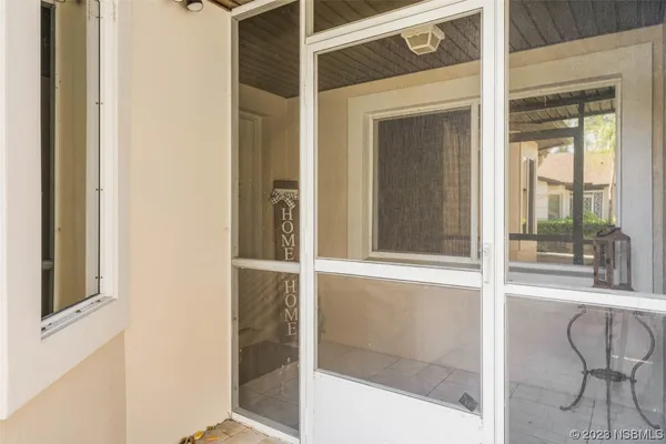 a view of a door and a window