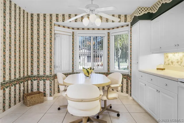 a kitchen with cabinets and window