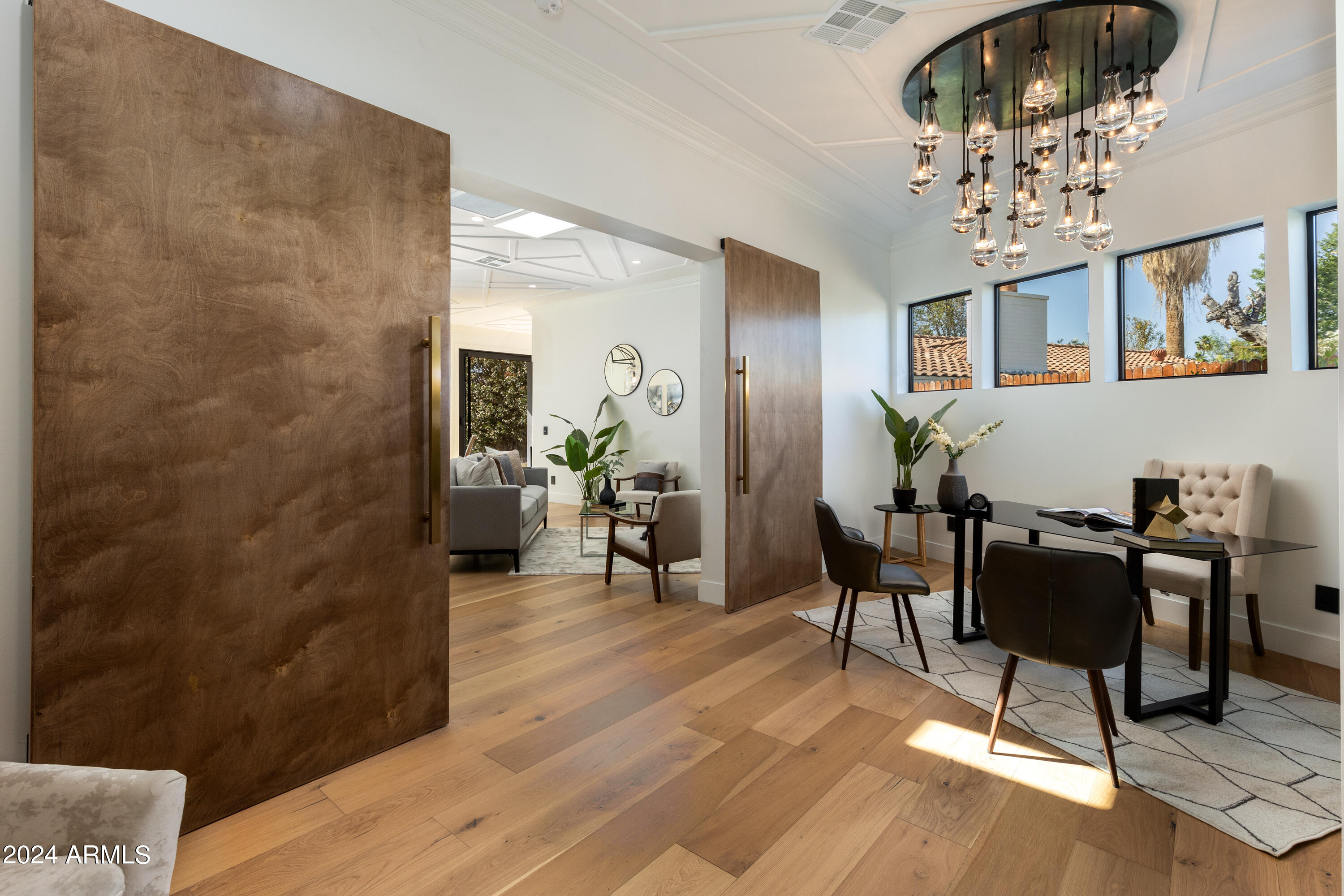 3045 North Marigold Drive Phoenix, AZ 85018 - Photo 18 of 65 a living room with furniture and a chandelier
