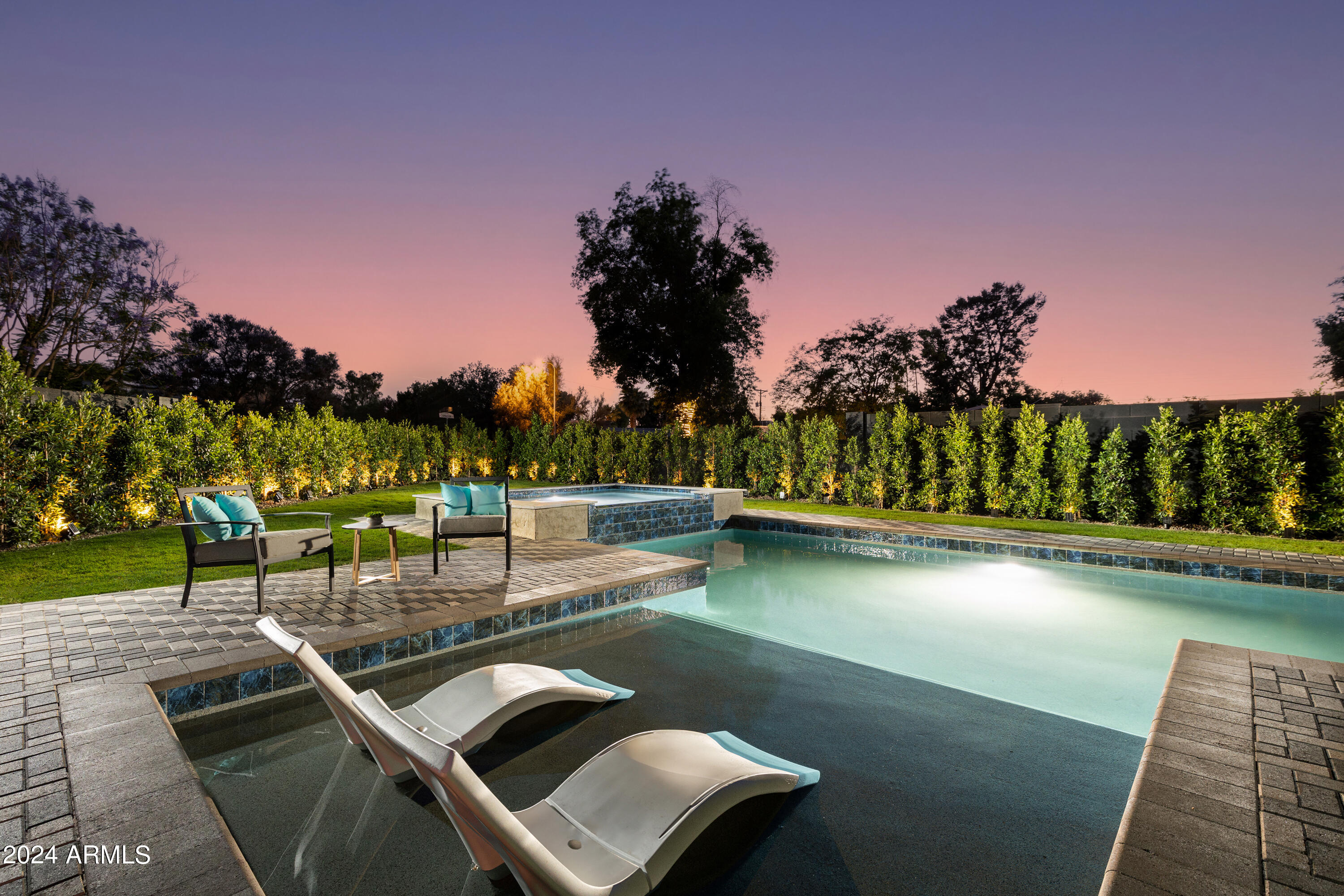 3045 North Marigold Drive Phoenix, AZ 85018 - Photo 2 of 65 a view of a swimming pool with a yard