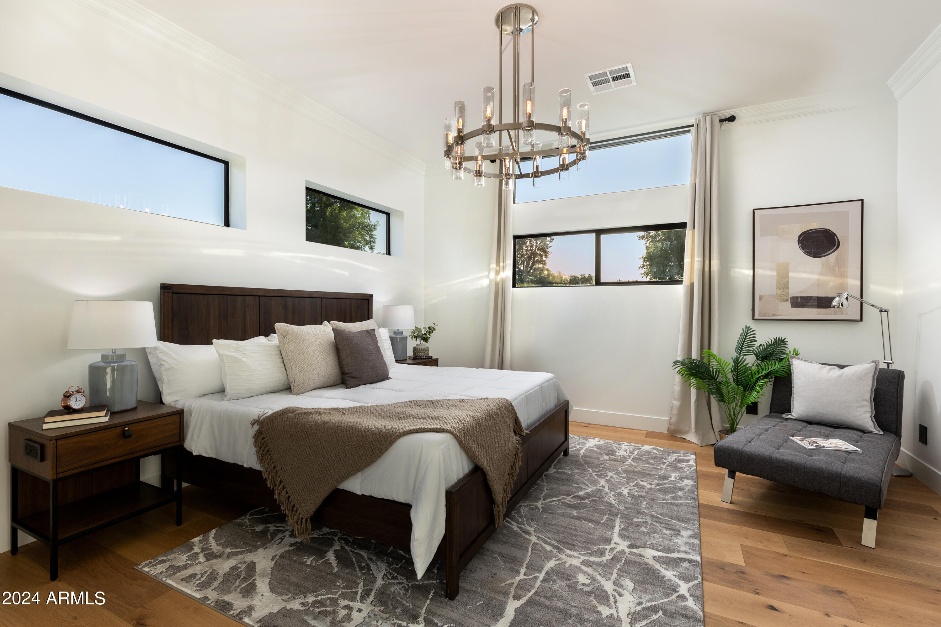 3045 North Marigold Drive Phoenix, AZ 85018 - Photo 26 of 65 a bedroom with a bed and a couch