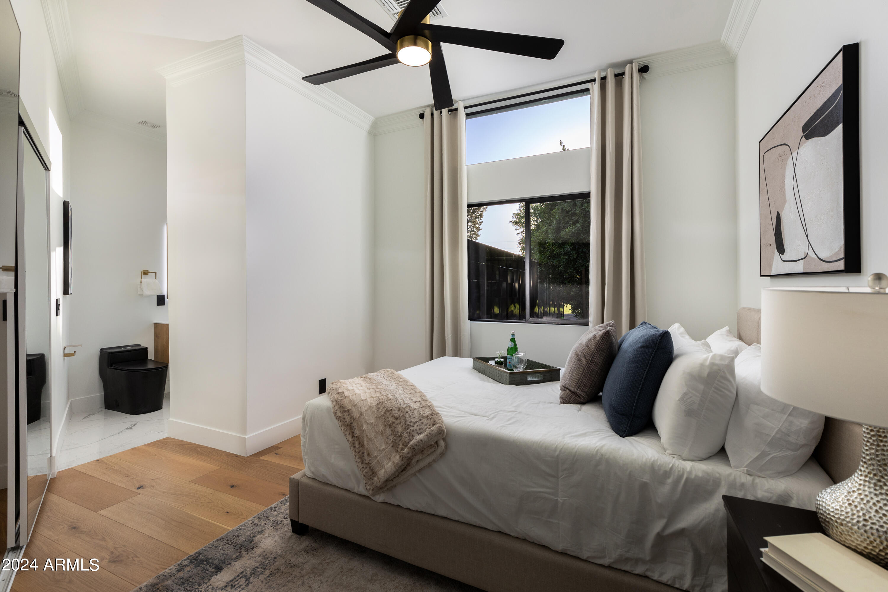 3045 North Marigold Drive Phoenix, AZ 85018 - Photo 33 of 65 a bedroom with a bed window and walk in closet