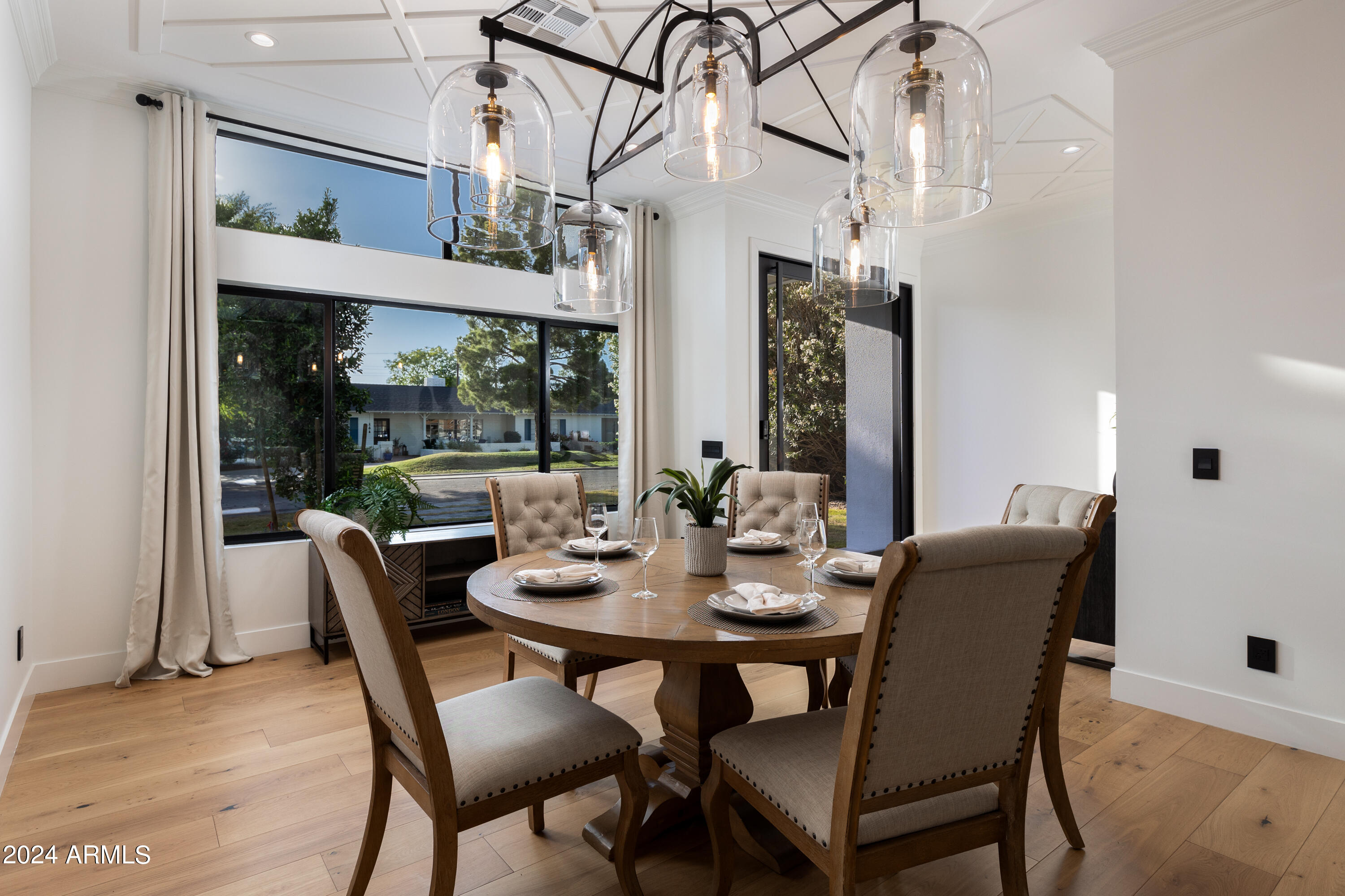 3045 North Marigold Drive Phoenix, AZ 85018 - Photo 9 of 65 a view of a dining room with furniture window and outside view