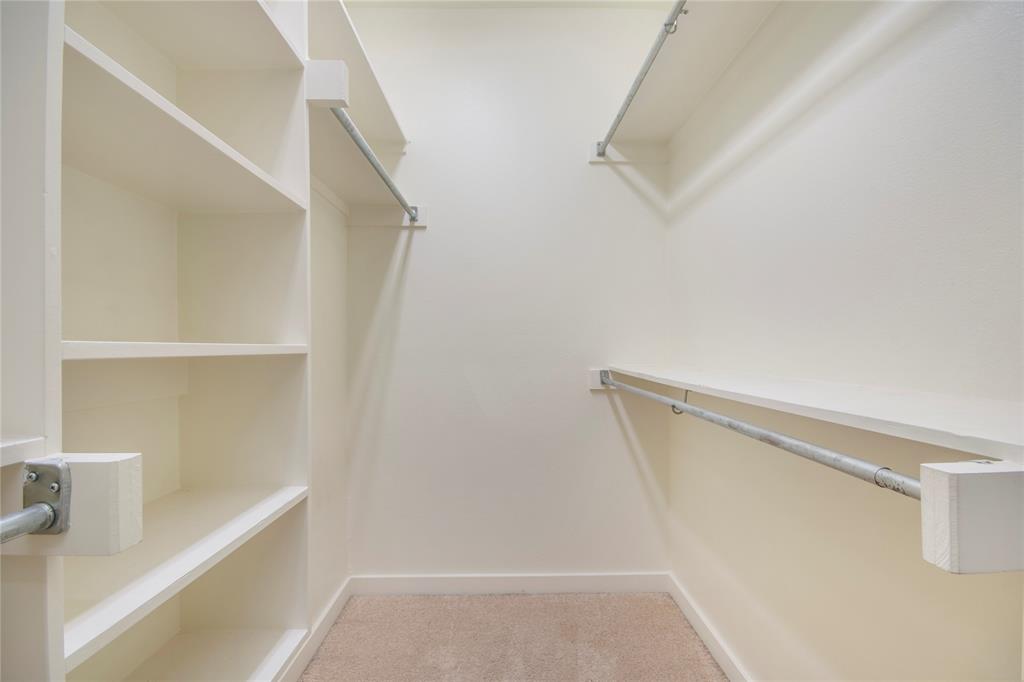 1016 Liberty Street, Unit 4 Dallas, TX 75204 - Photo 22 of 33 a view of walk in closet with empty racks