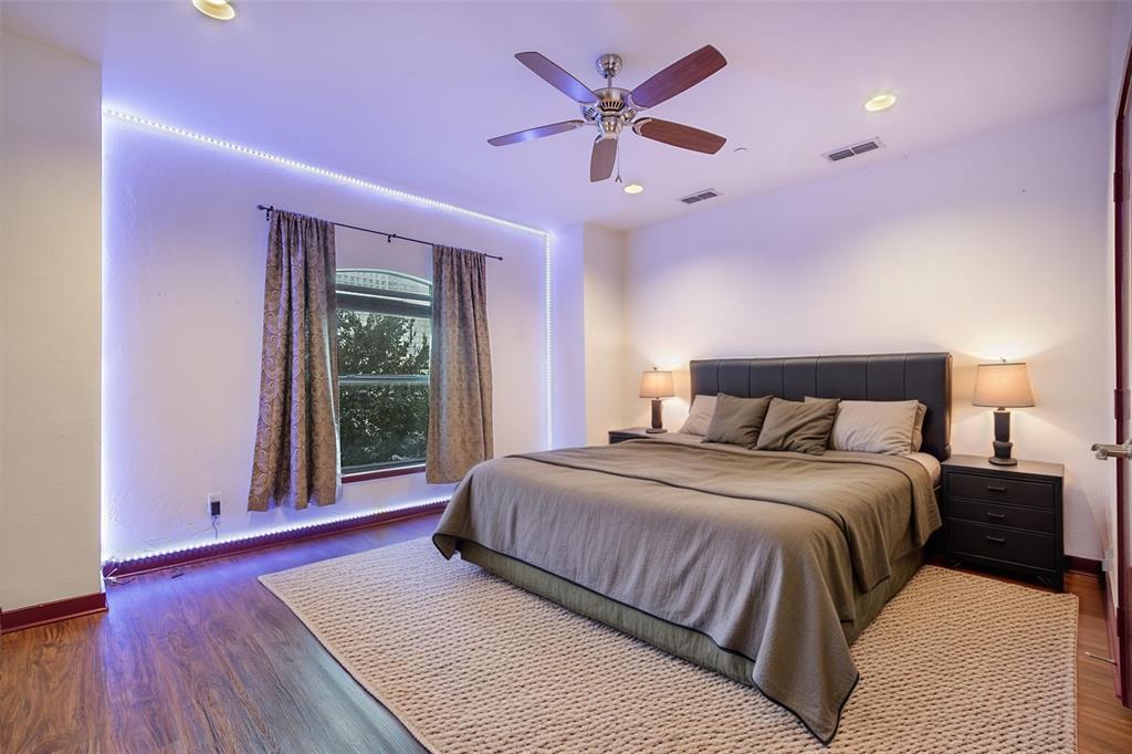 1016 Liberty Street, Unit 4 Dallas, TX 75204 - Photo 7 of 33 a spacious bedroom with a large bed and a large window