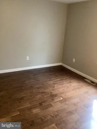 a view of an empty room with a sink