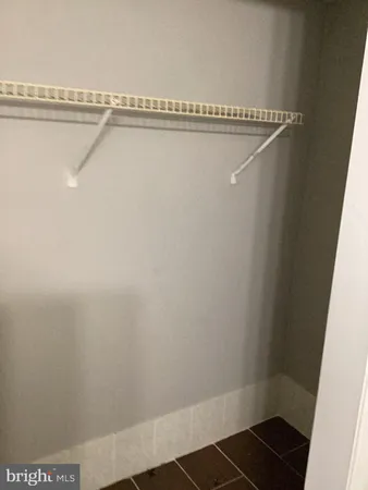 a view of a room with racks on the wall