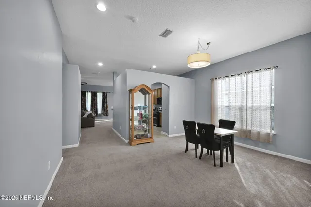 a view of a dining room with furniture window and outside view