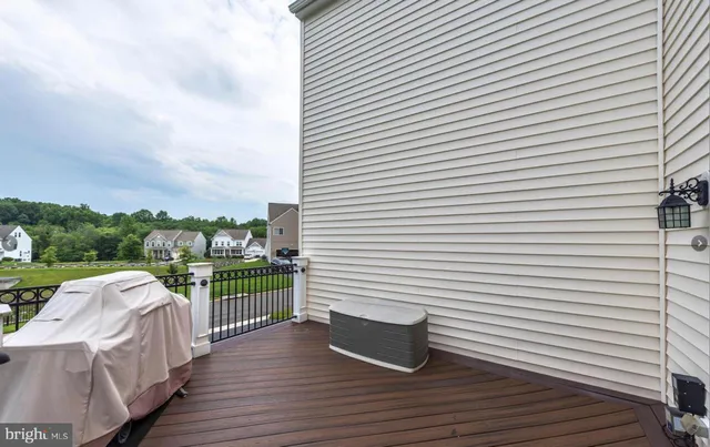 a view of a balcony with wooden floor space