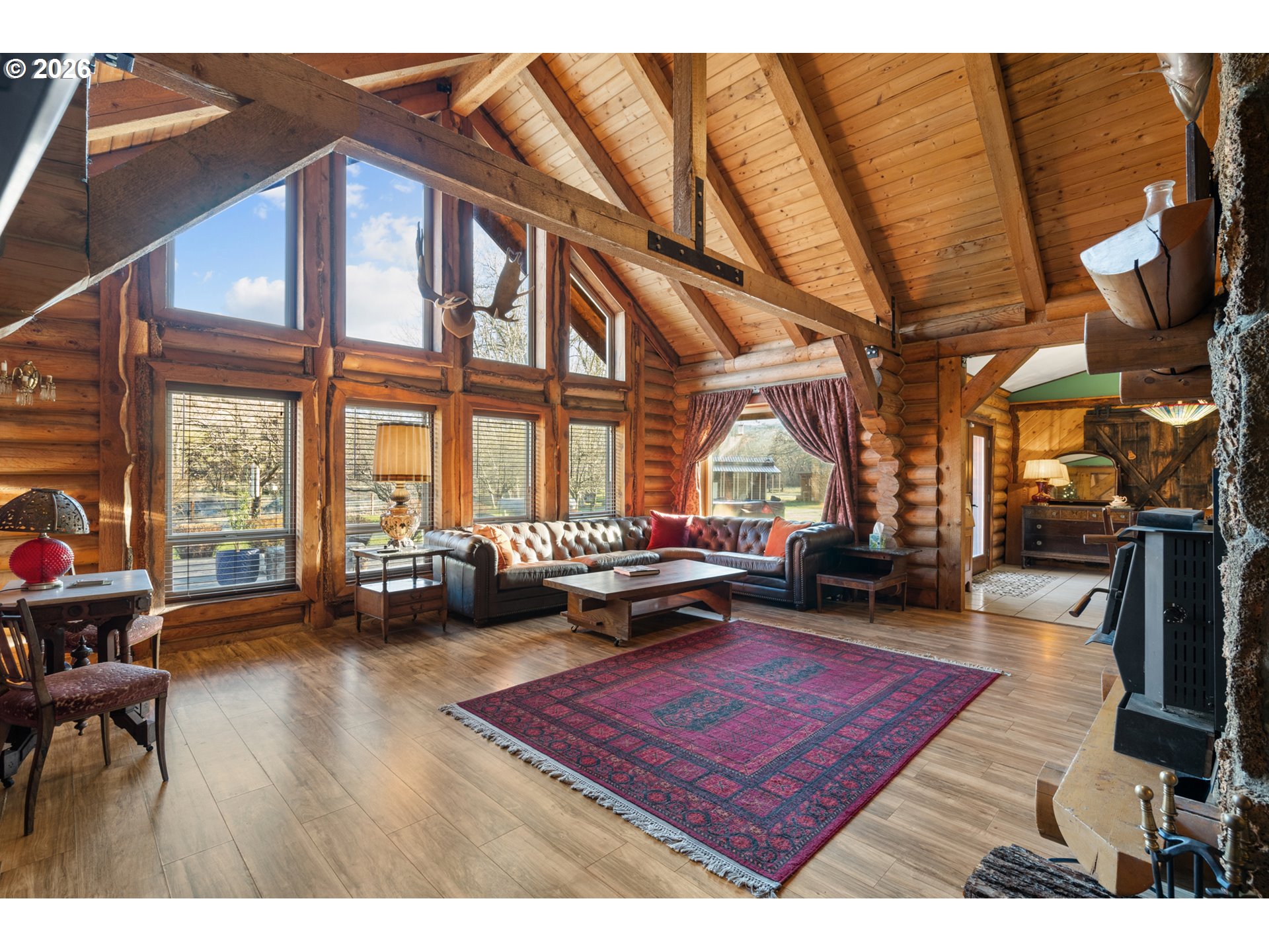 74091 Thornhollow Road Adams, OR 97810 - Photo 13 of 48 a living room with furniture a rug wooden floor and a large window