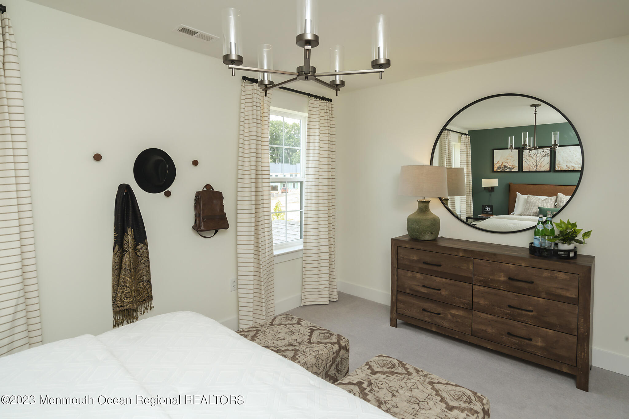 153 Woolley Court Asbury Park, NJ 07712 - Photo 17 of 23 a bedroom with a bed and a dresser