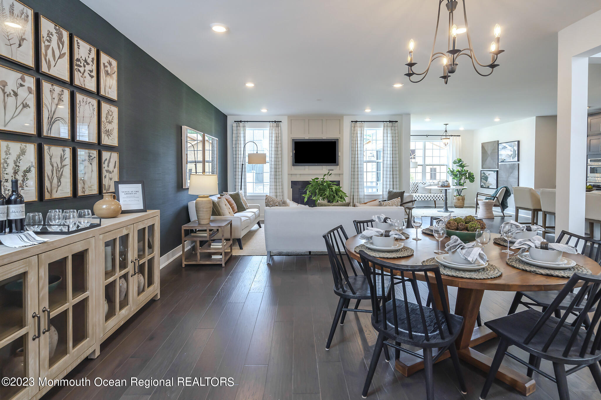 153 Woolley Court Asbury Park, NJ 07712 - Photo 3 of 23 a view of a dining room with furniture a chandelier and wooden floor